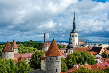 Tallinn Old Town skyline with medieval stone towers, red rooftops and St. Olaf's Church, seen from Patkuli Viewing Platform in Tallinn, Estonia.

