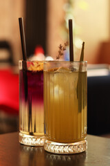 Delicious lemonades in glass cups. Refreshing drinks in a cafe or restaurant. Lavender and citrus...