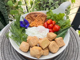 Soft boiled egg, Baked tofu with sourdough and mixed salad.
