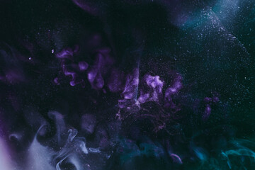 Abstract colorful background. Moving flow of purple paints, fluid liquid art, space sky