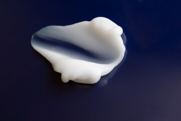 cosmetic cream smear on a blue background