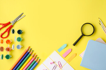 Colorful and vibrant Arts and Crafts Supplies beautifully arranged on a bright yellow background