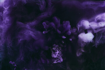 Abstract colorful background. Moving flow of purple paints, fluid liquid art, space sky