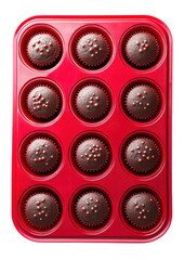 Fototapeta premium chocolate cupcakes in a red baking tray, top view.