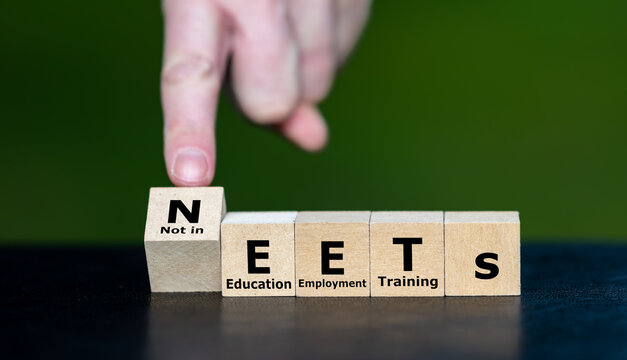 Cubes form the expression NEETs ((Not in Education, Employment, or Training). Symbol for people who are currently not in Education, Employment, or Training.