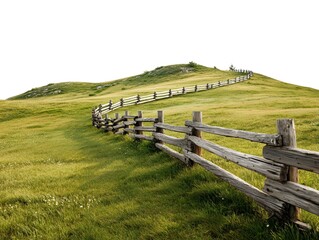 Fototapeta premium A scenic vista of a rolling hill is graced by a weathered, wooden fence that meanders along its crest