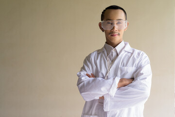 portrait of a young scientist gay man wearing safety glass goggles