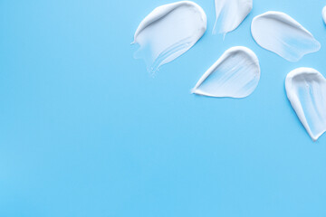 A smear of cream on a light background. Beauty concept.