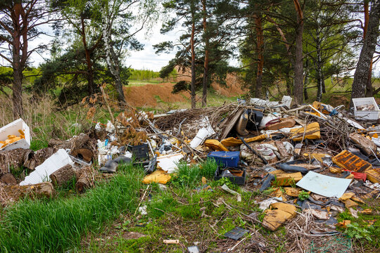 Unauthorized garbage dump in nature, illegal waste disposal