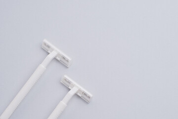 Disposable plastic razor with steel blade, men's and women's razors. Skin and body care concept....