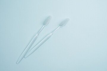 White toothbrushes on a color background. Replace your old toothbrush with a new one. Old and new...