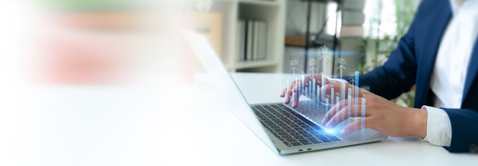 AI Driven Customer  Analytics Concept. Hands typing on a laptop with a digital overlay of interconnected data analysis and artificial intelligence icons, representing an AI powered customer insights.