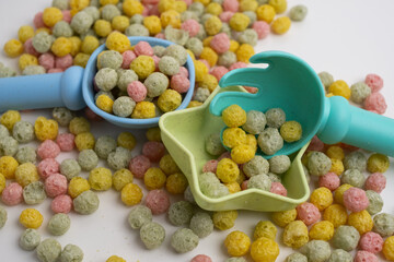 Children's toys, a shovel, a rake and crispy colorful snacks. Summer mood on the beach