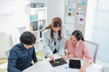 diverse business professionals engage in a dynamic brainstorming meeting, analyzing AI-powered...