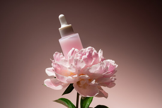 Elegant cosmetic dropper with peony blossom