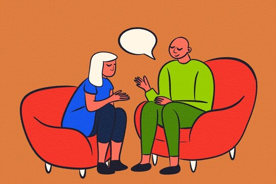 Two people conversing in a supportive environment