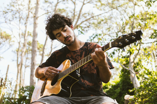 Man playing guitar in La Paloma, Uruguay