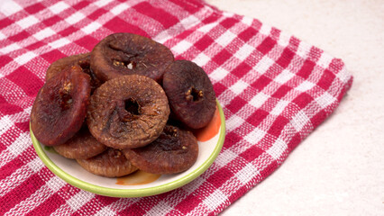 Fresh Figs or Anjeer fruit healthy vegan food concept organic dry fruits on wooden background.