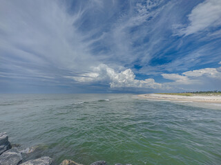 Mexico Beach at Canal Parkway, looking west toward the Gulf of Mexico—pristine white sand, calm surf, and endless coastal horizon.