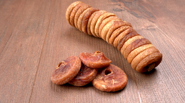 Fresh Figs or Anjeer fruit healthy vegan food concept organic dry fruits on wooden background.