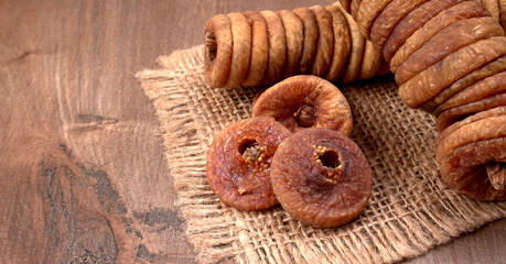 Fresh Figs or Anjeer fruit healthy vegan food concept organic dry fruits on wooden background.
