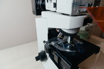  close up medical electronic microscope with a focus on the glass slide used for laboratory analysis