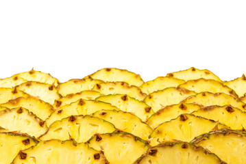 Pineapple juicy yellow slices background. Top view.