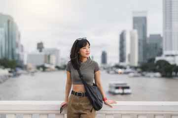 Solo Southeast Asian woman teenager blogger world travel explorer on local cultural experience to...