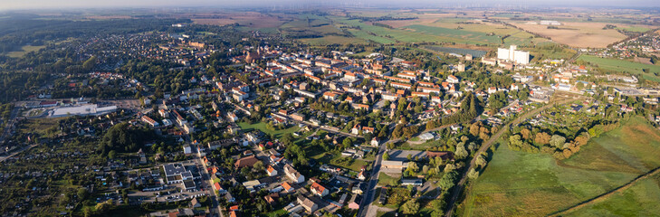 Aerial panoramic view around the old town of the city Pasewalk on a sunny morning in summer in Germany.