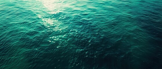 Naklejka premium Green water sea wave surface ripple mystery light reflection glow and gloss gradient turquoise deep clear and clean ocean horizontal.