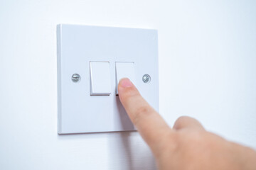 Fingers flipping switch, demonstrating electrical safety, electrical safety, home appliance...