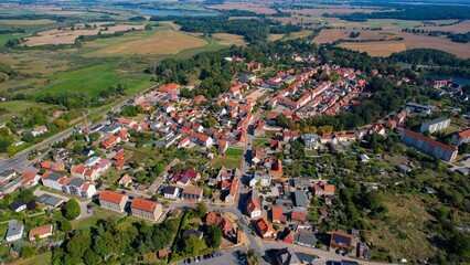 Aerial panoramic view around the old town of the city Penzlin on a sunny noon in summer in Germany.