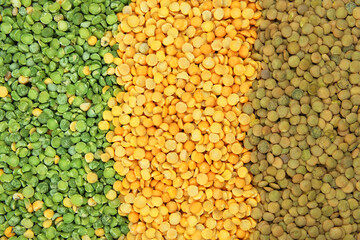 Variety of protein products for vegetarians. Yellow and green peas and lentils. Grocery background. Top view.