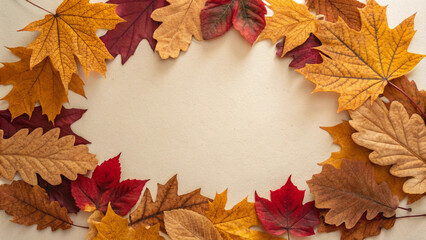 Vibrant arrangement of fall foliage in various shades of red, orange, and yellow forms a decorative border on a neutral background, evoking the cozy and inviting atmosphere of autumn