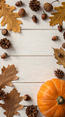 Pumpkin, dry leaves, pine cones, acorns, cinnamon sticks, and brown cozy blanket are arranged on a white wooden background, creating a warm and inviting autumn atmosphere with copy space