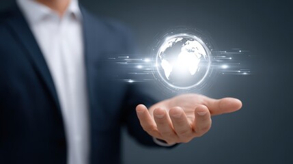 Fototapeta premium Businessman holding a glowing digital globe with glowing lines and technology interface representing global connectivity and digital innovation concept
