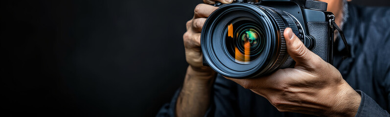 photographer holding a  camera 
