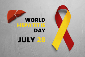 28th july World Hepatitis Day. Yellow-red awareness ribbon and illustration of liver on grey textured background, top view