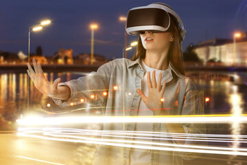 Woman using virtual reality headset, double exposure with cityscape