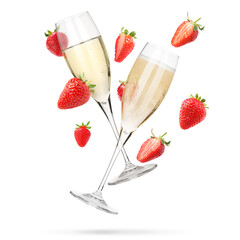 Sparkling wine in glasses and fresh strawberries falling against white background