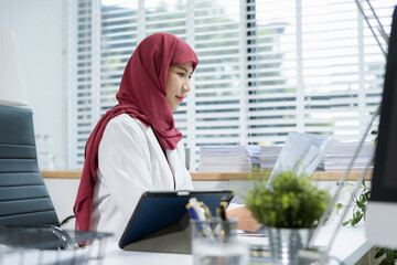 Businesswoman analyzing financial graphs, calculating company expenses.