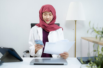 Businesswoman analyzing financial graphs, calculating company expenses.