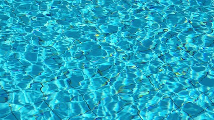clear blue water surface with sunlight reflections creating a serene and tranquil swimming pool atmosphere for relaxation and leisure activities