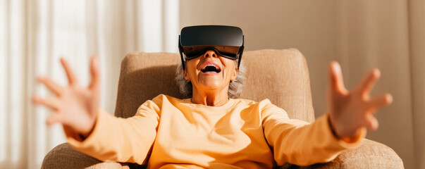 Amazed senior woman sitting on armchair wearing vr headset exploring metaverse and interacting with virtual reality
