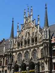 Munich, Marienplatz: detail of the front facade of the gothic New Town Hall