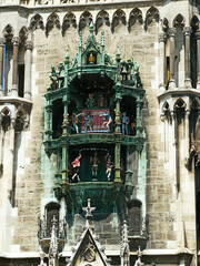 Munich, Marienplatz : detail of the rich gothic architecture of the New Town Hall and the Glockenspiel  mechanical clock with 43 bells and 32 figures of coopers dancing and knights