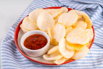 Crispy airy rice shrimp chips. Fragrant prawn crackers with sauce