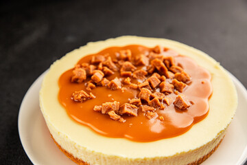 Cheesecake salted caramel sweet dessert fresh delicious gourmet food background on the table rustic food top view copy space