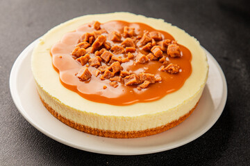 Cheesecake salted caramel sweet dessert fresh delicious gourmet food background on the table rustic...