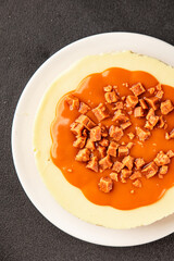 Cheesecake salted caramel sweet dessert fresh delicious gourmet food background on the table rustic food top view copy space